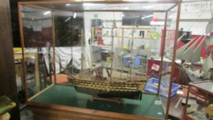 A large cased model of a galleon.
