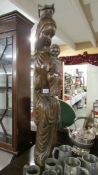 A tall carved wood figure of Madonna and Child.