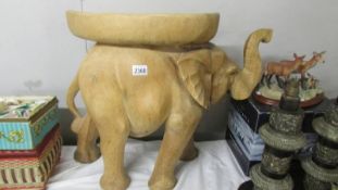 An old wooden elephant seat.