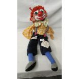 A vintage clown ventriloquist dummy (missing arms), 65 cm tall.