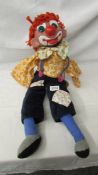 A vintage clown ventriloquist dummy (missing arms), 65 cm tall.