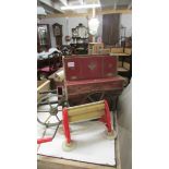 A very old and very distressed child's barrel organ and a child's mangle.