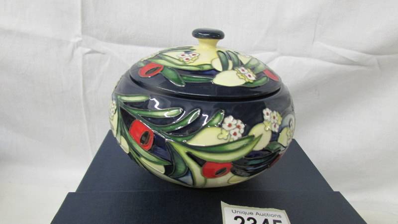 A limited edition Moorcroft lidded pot, signed, 2/40. - Image 2 of 3