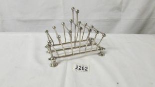 An early 20th century silver plate toast rack (in the style of Christopher Dresser).