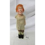 A rare 'Bisto' kids doll in original outfit (missing one arm), 30 cm.