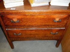 A two drawer oak chest.