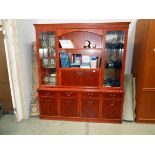 A wall unit with cupboard drawer base and glazed/open top Height 193cm, width 171cm,