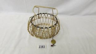 A French 1950's Erdecor gold plated wire collapsible egg basket.