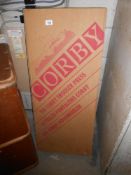 A Corby mahogany effect trouser press,