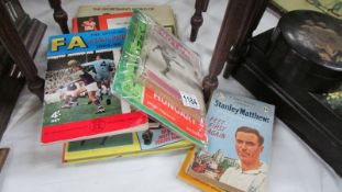A mixed lot of football related books, magazines, programmes etc.