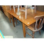 An oak dining table with folding top, 138cm x 84cm, folded 84cm x 69cm,