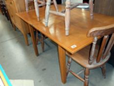 An oak dining table with folding top, 138cm x 84cm, folded 84cm x 69cm,