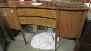 A good mahogany inlaid concave front sideboard.