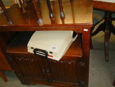 A good quality oak cabinet with linen fold doors.