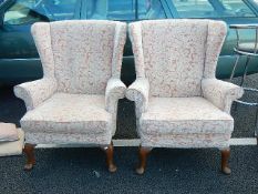 A good pair of salmon / white wing back arm chairs