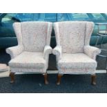 A good pair of salmon / white wing back arm chairs