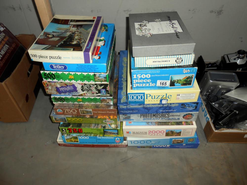 A quantity of jigsaw puzzles, some sealed,