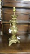 An ornate brass table lamp.