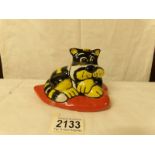 A Lorna Bailey yellow and black striped cat on heart shaped cushion, 12 cm.
