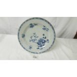 A blue and white floral decorated Chinese plate.