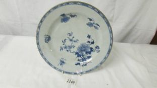 A blue and white floral decorated Chinese plate.