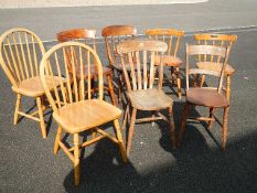 A good collection of 8 hard seated chairs