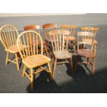 A good collection of 8 hard seated chairs