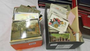 2 boxes of assorted postcards.