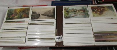 A good album of postcards including topographical.