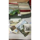 A box of assorted postcards including trains, transport, topographical etc.