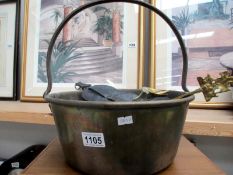 A vintage brass water pail and contents