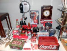 A large quantity of Coca Cola items, including glasses, clock telephone, tooth pick holder,