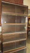 A 6 tier sliding glass door bookcase.