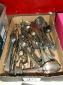 A large quantity of sugar tongs, spoons etc.