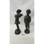 A pair of bronze figures of a boy and girl, 23 cm tall.