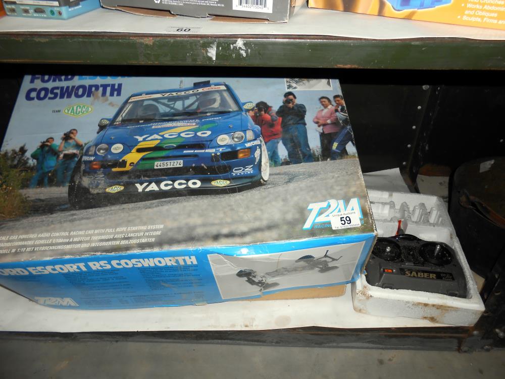 A boxed T2M Ford Escort RS Cosworth remote control car 1/10 scale,