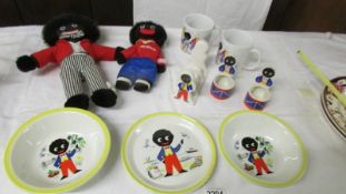 A mixed lot of Robertson's collectables including 2 Golly's, toast rack, egg cups, mugs etc.