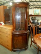 A mahogany finished corner cupboard with astragal glazed door, height 182cm, width 65cm,