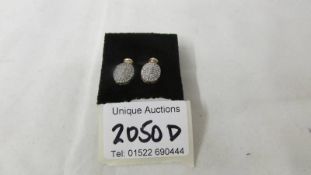 A pair of yellow gold oval earrings set diamonds, weight 2 grams.