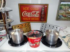 A selection of Coca Cola ice buckets, drip trays,