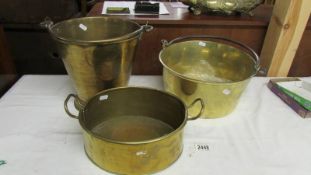 A brass bucket, a brass jam pan and another brass pan.