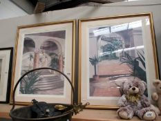 A pair of gilt framed prints featuring interior scenes