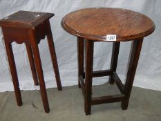 A solid round top oak side table and a pot stand.