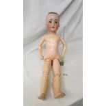 A German porcelain headed doll with composition body, marked S PB (in a star) H, 1900 - 06, a/f,