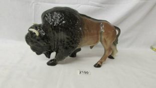 A large Melba ware buffalo, 36 cm long, 21 cm tall. (a/f, one horn has been repaired).