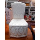 A cream fabric nursing chair height 81cm