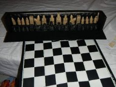 A cased chess set.