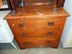 An Edwardian satin walnut chest of drawers