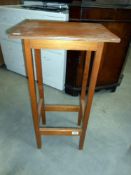 A 1930's oak/ply pot stand height 75cm,