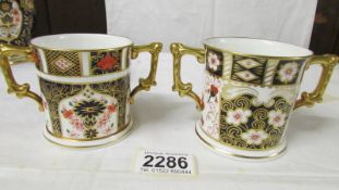 Two Royal Crown Derby loving cups.